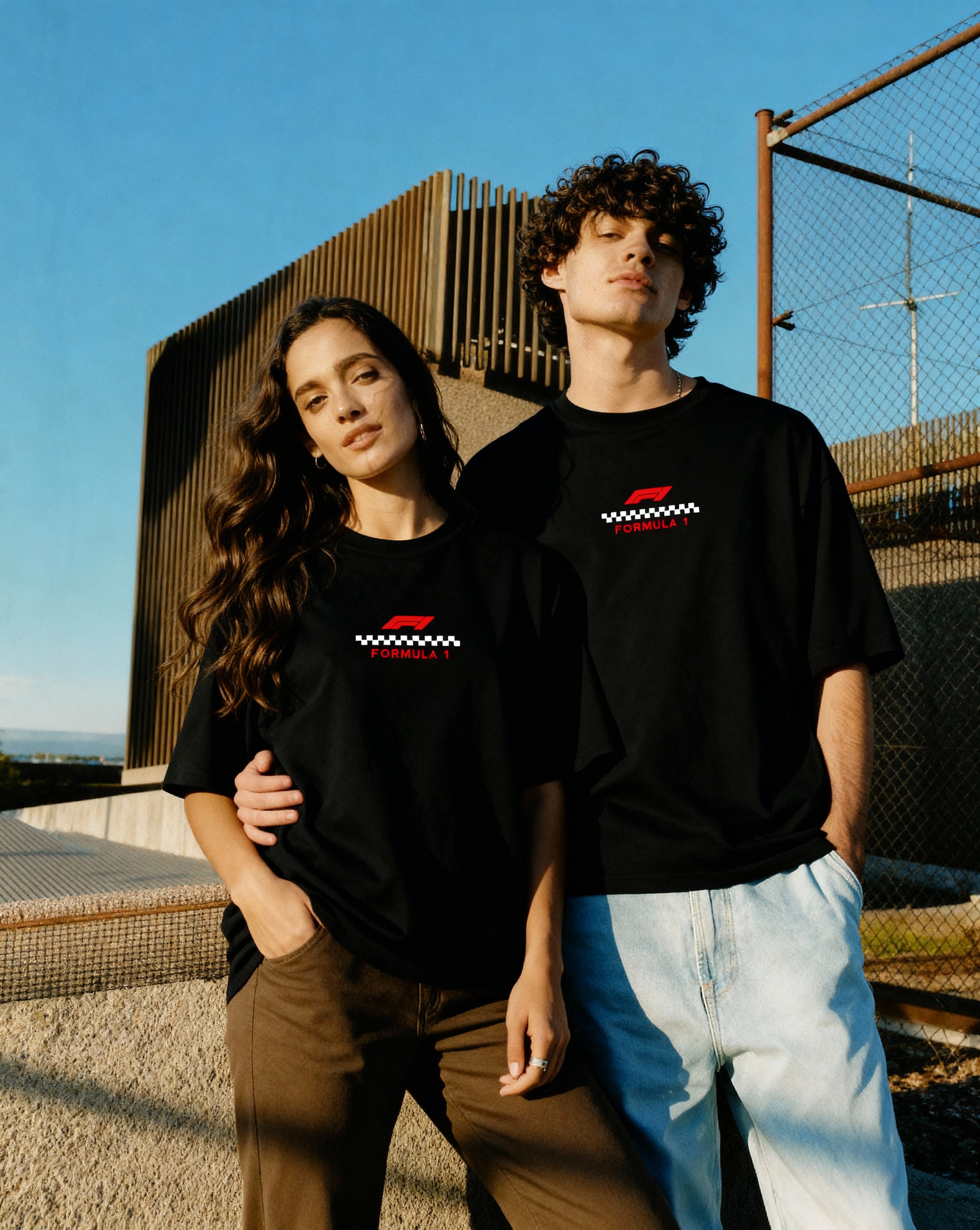 man and women in oversized black t-shirt