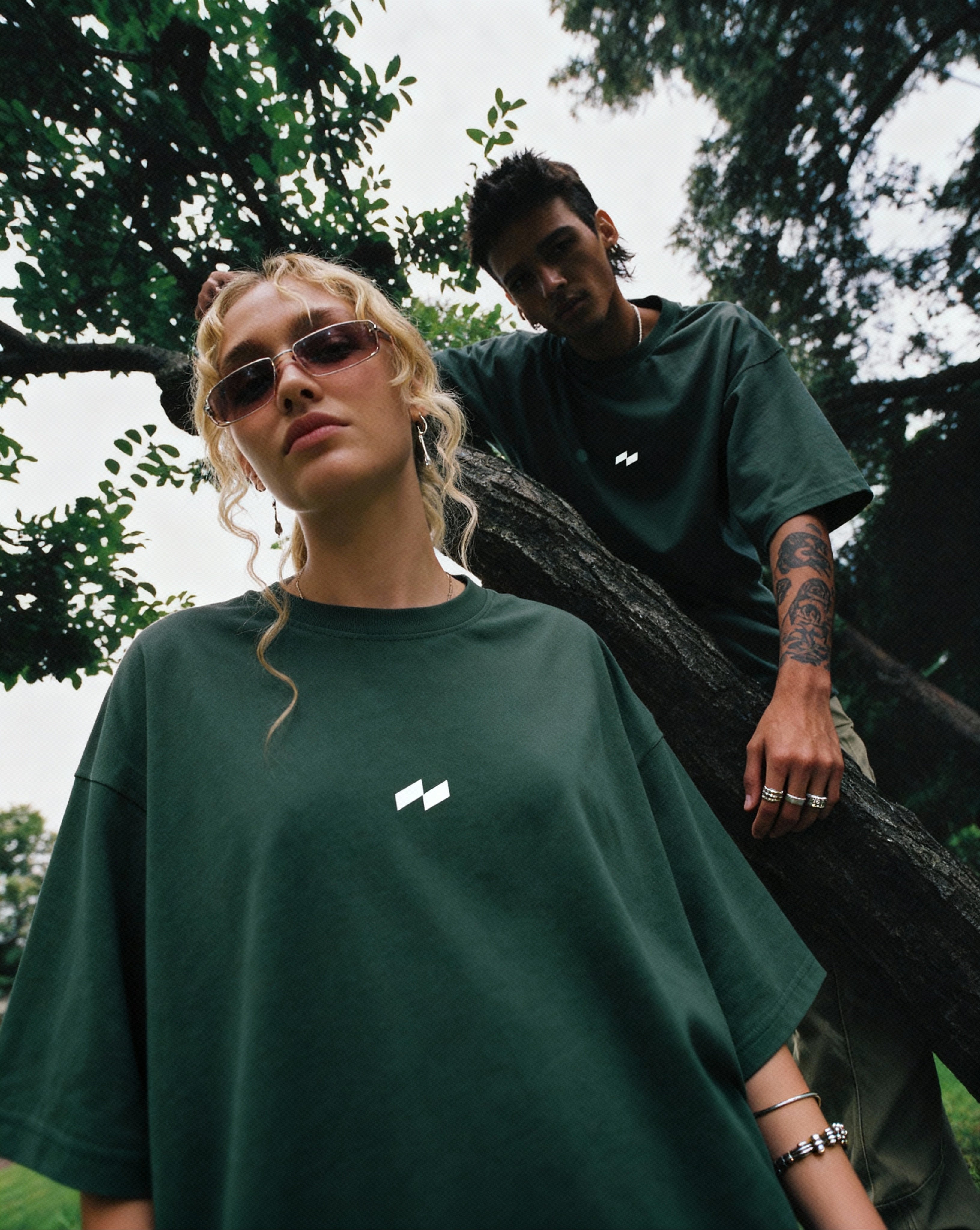 man and woman wearing relaxed fit green t-shirt